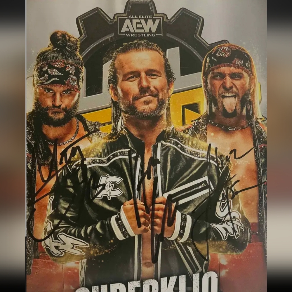 Autographed Adam Cole and Young Bucks 8x10